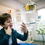 invisalign patient taking a selfie for dental monitoring