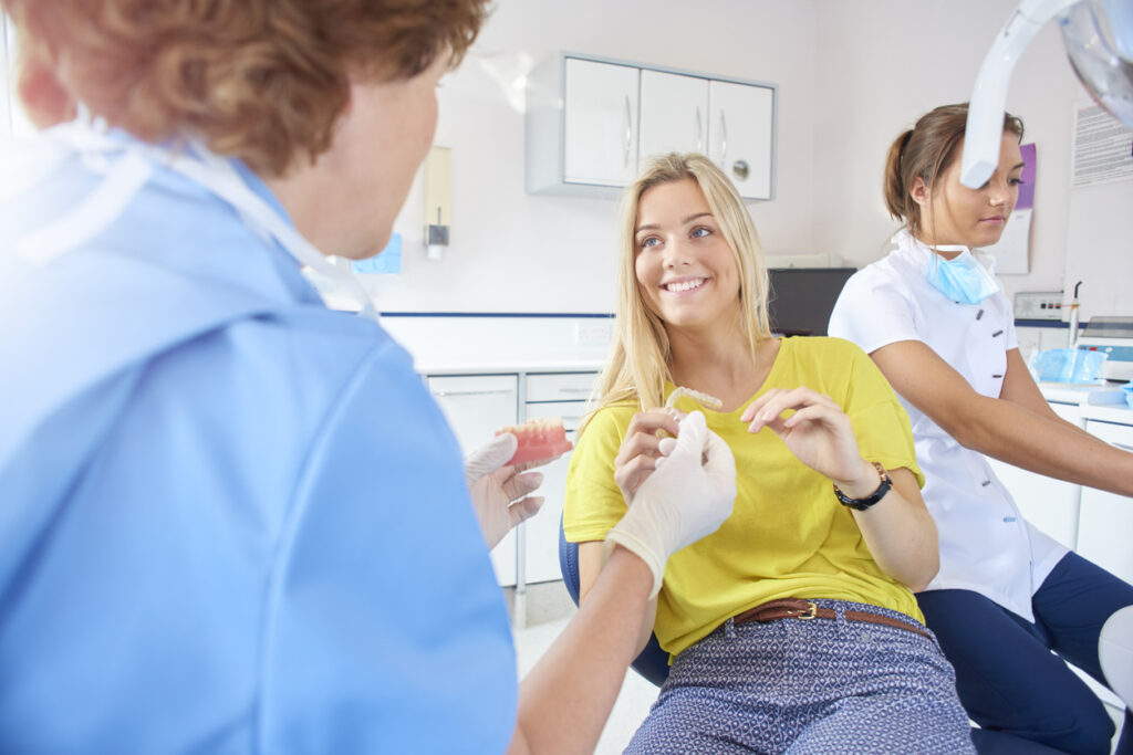 teenager-with-invisaliagn-aligners-at-orthodontics-office